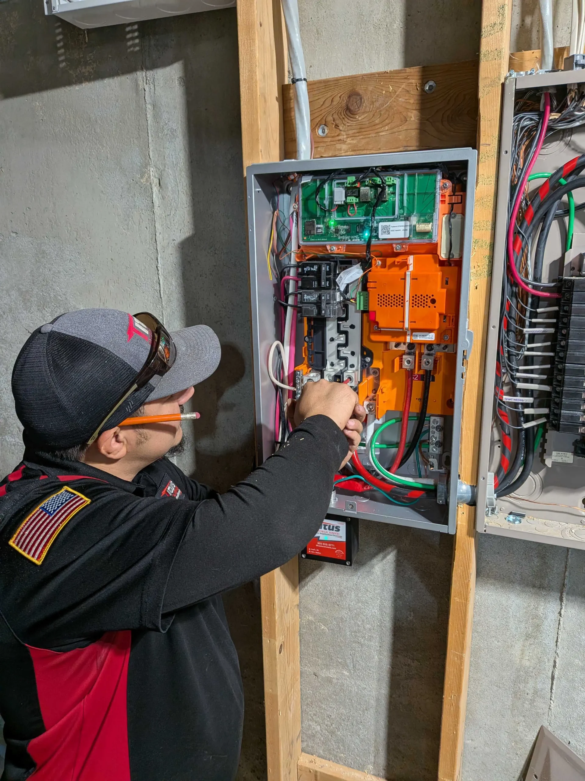 Titus employee working on an electrical panel